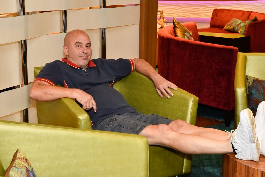 a man lounging with his feet up